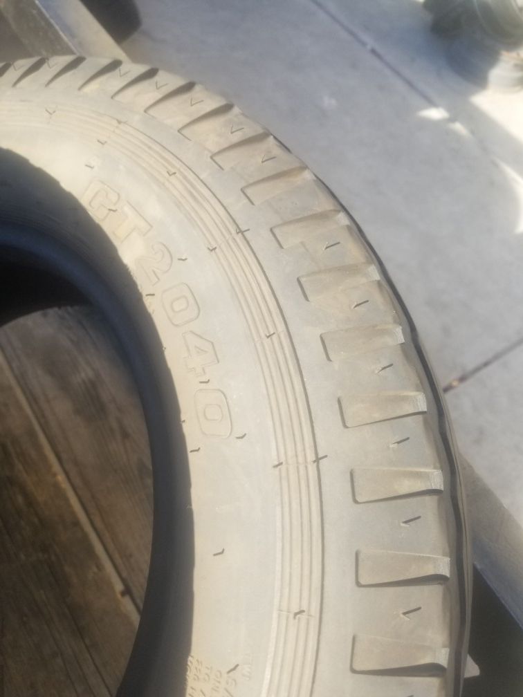 set of 4 a year old st 205 75 14 trailer tires in great shape
