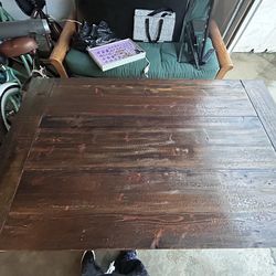 Wooden Table with white chairs