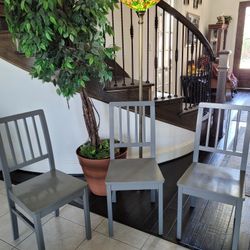 1 Gray Wooden Chair.