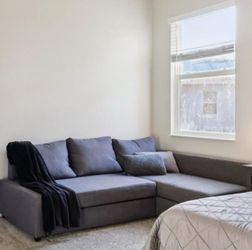 Grey sleeper sectional with storage