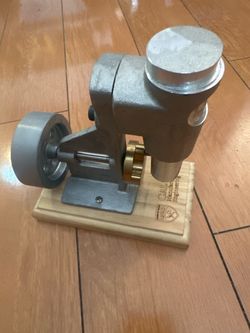 student air-engine project mounted on a custom-engraved wooden display block.