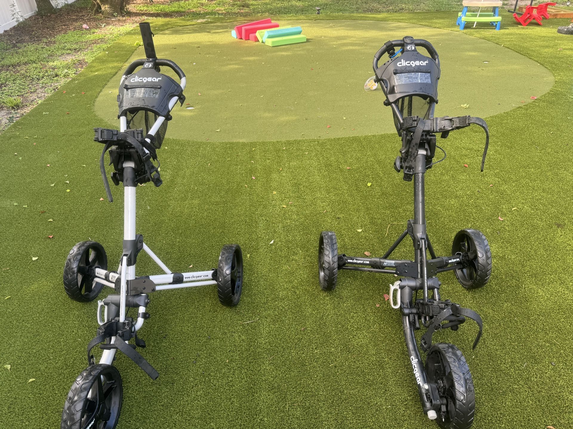 Two Golf pushcarts
