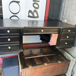 dark wood executive desk similar to models from the Hooker Furniture Telluride collection