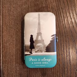 New Shannon Martin Design manicure kit, retro Parisian scene with the Eiffel Tower, housed in a leatherette-covered metal case decorated with an Audre