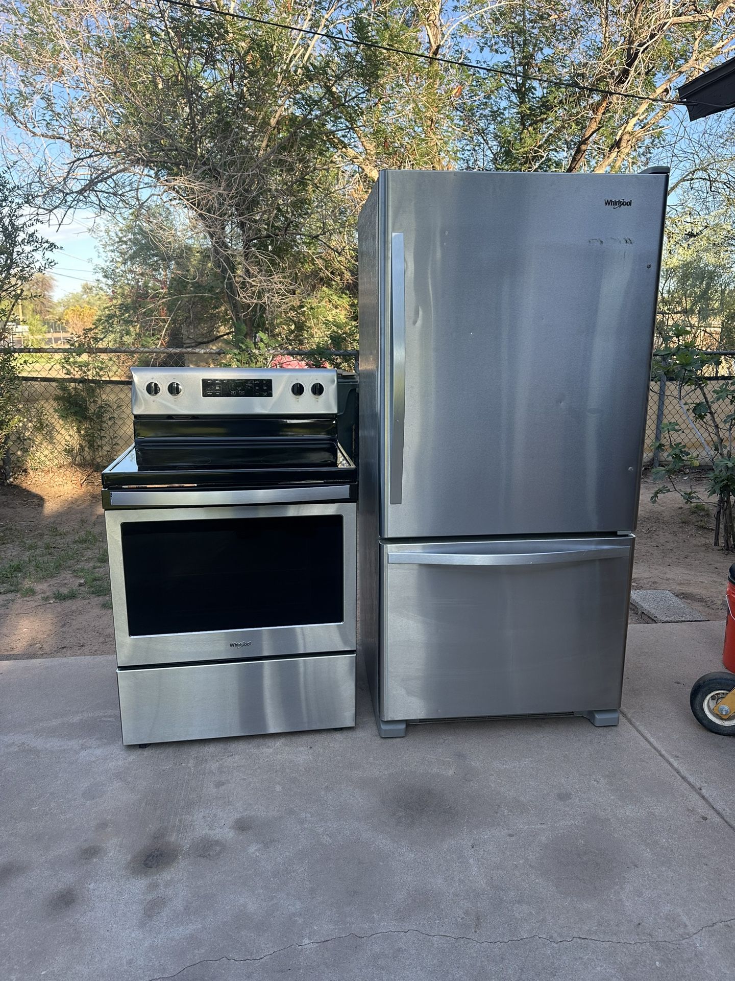 Whirlpool top, bottom, refrigerator, and electric stove