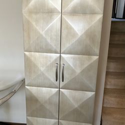 Tall gold cabinet