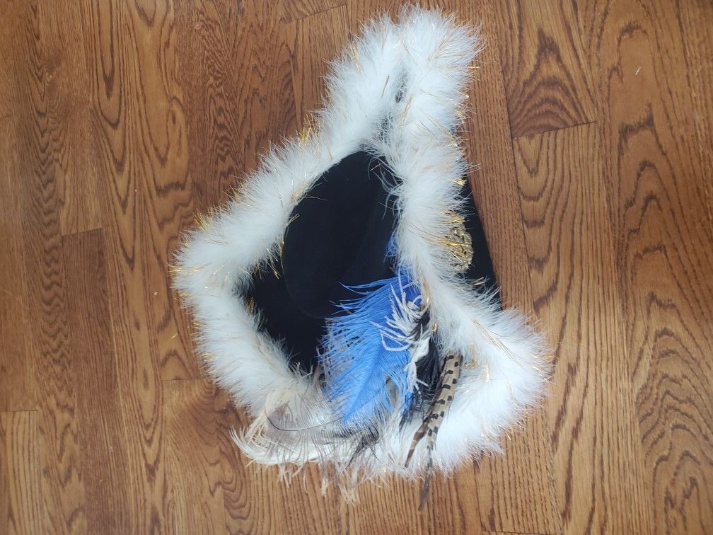 American colonist hat with metal brooch and feathers