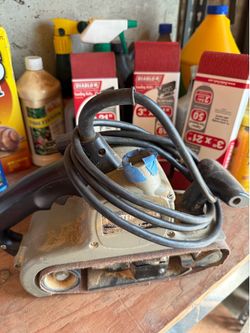 Belt sander. With papers.