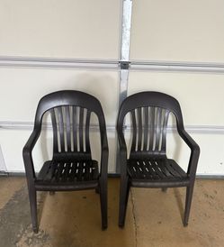 Set Of Two Brown Plastic Chairs 
