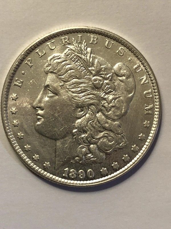 1890-CC EF MORGAN SILVER DOLLAR, CLEANED ROUGHLY ON OBV. FREE SHIPPING.