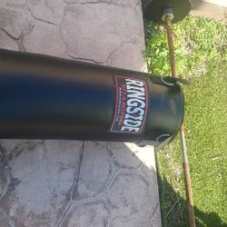 100 Pnd Punching Bag And Two 25 Pnd Plates And Solid Bar