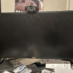 Dual ASUS monitors With Arms And Logitech Webcam