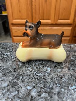 Vintage Ceramic Dog & Bone Stacker Pair of Salt & Pepper Shakers.  Size approximately 4 1/2 inches wide and 3 1/2 inches tall.  Brand new never used.