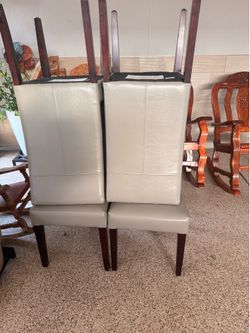 Pier1:  4 chairs  color  light gray .