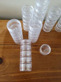 44 small round containers that hook together.
