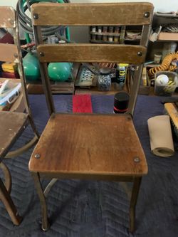 Two antique school chairs