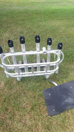 6 Rod fold down Rod Rack Manufactured by Anglers Aluminum Products. Includes mounting bracket and bait cutting table.