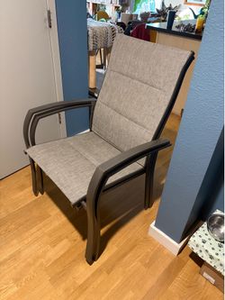 Two outdoor chairs with armrests