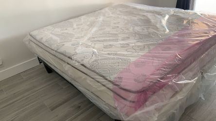 New king mattress and box springs bed frame is not included