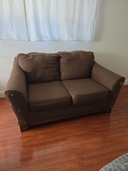 Used 3-seater and 2-seater couch set - dark brown