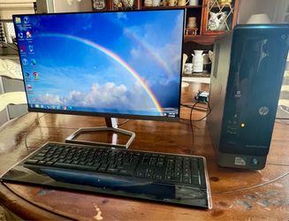 HP Pavilion Slimline series desktop computer tower paired with a flat-screen monitor and keyboard..