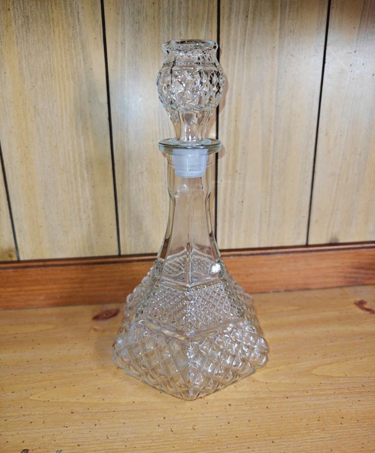 Clear glass Wexford decanter with matching glass Wexford stopper with a plastic end for the cork.