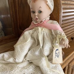Gerber porcelain doll with tag on the doll