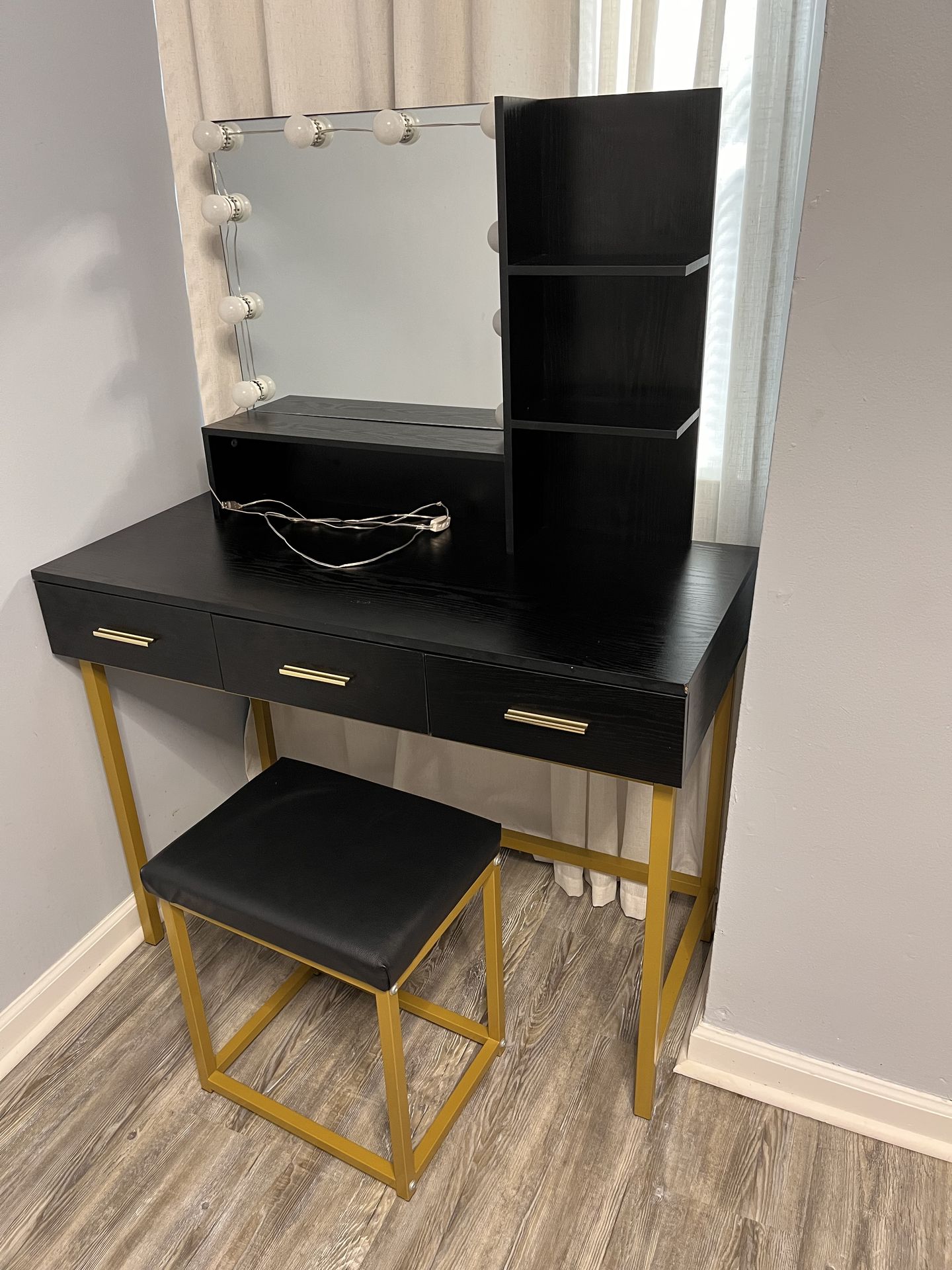 Vanity with cushioned stool