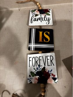 Hanging wood panels say family is forever