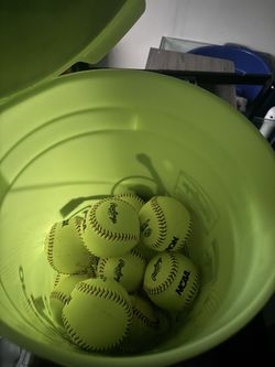 Bucket of ncaa softballs