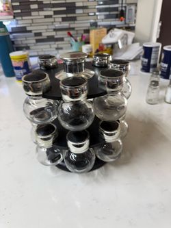 Rotating spice rack with 15 glass jars used good condition