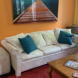 Beautiful couch with Foldout queen mattress & 2 Matching foot stools