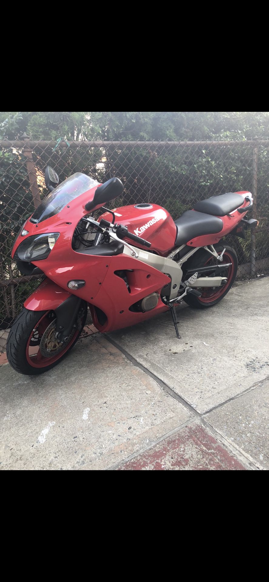 Red Kawasaki ninja 650 motorcycle year 2000