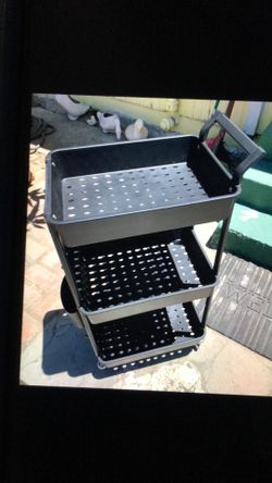 Three tier black plastic rolling cart