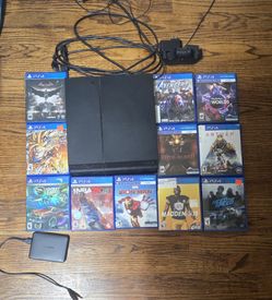 500 GB PS4, 1TB external storage. 11 games. Controller. Controller charging station.