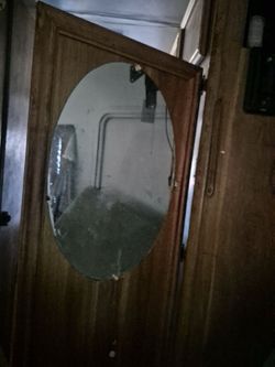 Oval beveled edged mirror.