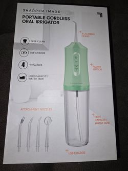 Cordless portable oral irrigator