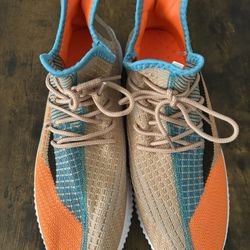 Size 11 / Supermo branded sneakers. The name "Supermo" can be seen on the heel pull tabs of the shoes in a teal/blue color. 