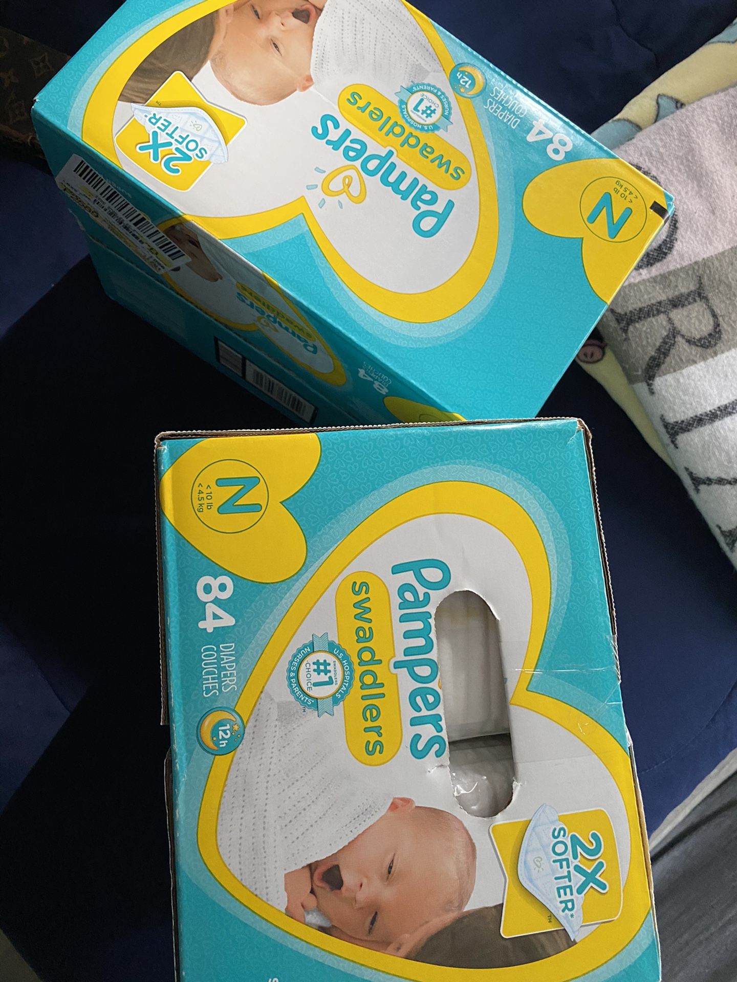 2 boxes of Newborn Diapers Each (84 Count )