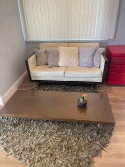 Wood/leather loveseat + low profile coffee table.