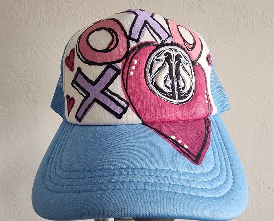 XOXO SYMBIOTIC MUSIC TRUCKERS HAT
