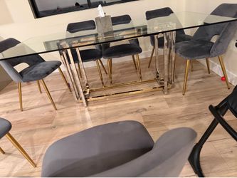 Dining table , glass, metal and gold bases