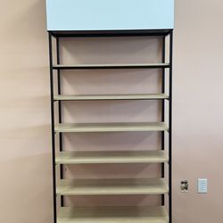 Storage rack with Storage box up top.