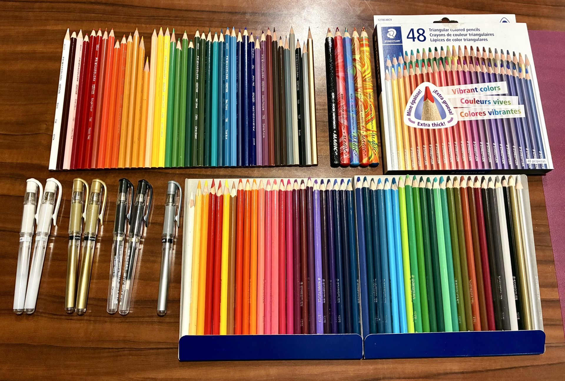 41 Prismacolor Verithin - 48 Staedtler pencils - 7 Uniball Signo UM-153 gel pens - 5 Koh I Noor Magic pencils