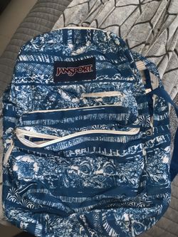 blue patterned jan sport with laptop slot