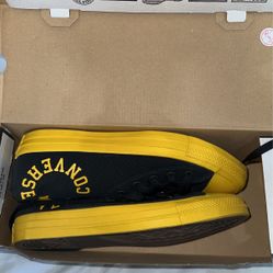 Yellow and black converse 