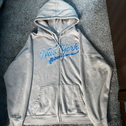 Beige Garage hoodie with Blue New York Text