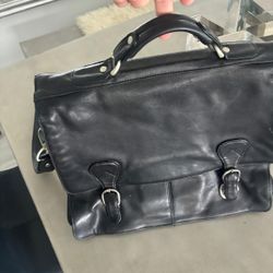 Kenneth Cole Leather laptop briefcase in black.  High-quality leather with fabric lining and silver hardware