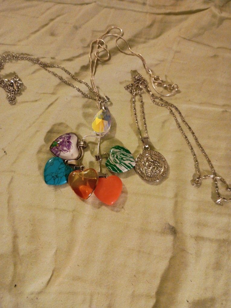 4 Necklaces 5 Heart Shaped Pendents And A Saint Christopher Medal In Perfect Condition