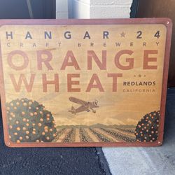 Hangar 24 orange wheat wood sign